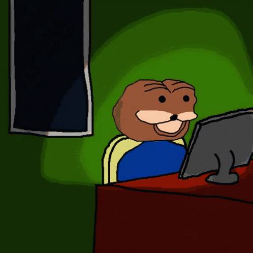 A Cartoon Character Is Sitting In Front Of A Computer Screen GIF