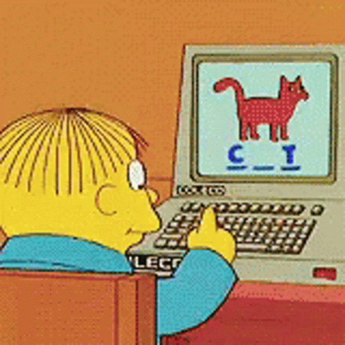 A Cartoon Character Is Sitting In Front Of A Computer With The Letter C On The Screen GIF