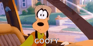 A Cartoon Character Is Sitting In The Driver 'S Seat Of A Car And Says `` Goofy '' . GIF