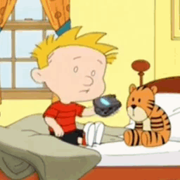 A Cartoon Character Is Sitting On A Bed Holding A Remote Control GIF