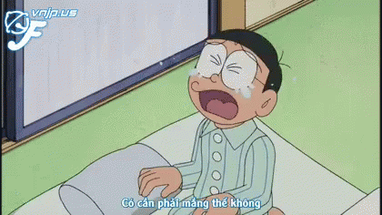 a cartoon character is sitting on a bed with a pillow and says minh moi ve khuya mot chut thoi ma