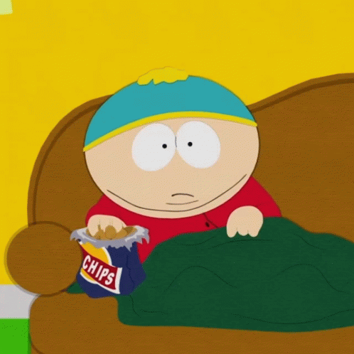 A Cartoon Character Is Sitting On A Couch Eating Chips GIF
