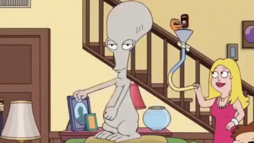 A Cartoon Character Is Sitting On A Couch In A Living Room Next To A Staircase . GIF
