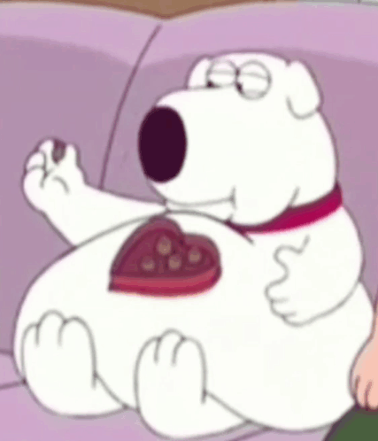 Cartoon Character Sitting On Couch With Heart Chocolates GIF