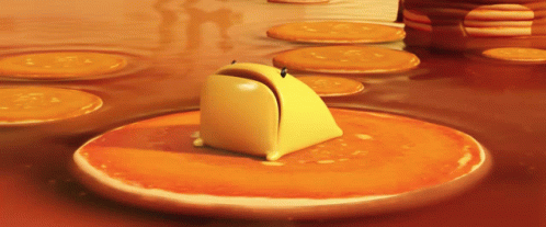 A Cartoon Character Is Sitting On A Pancake GIF