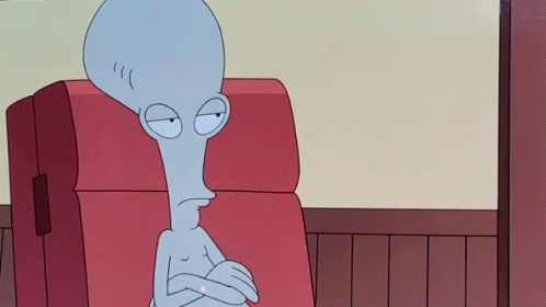 Cartoon Character Sitting On Red Couch With Crossed Arms GIF