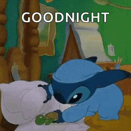 A Cartoon Character Is Sleeping In A Bed With A Turtle And The Words `` Goodnight '' . GIF