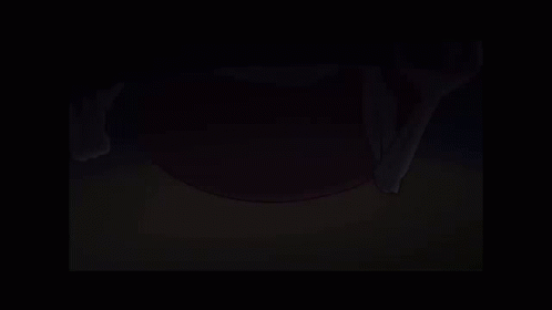 A Cartoon Character Is Standing In A Dark Room Holding A Broom . GIF