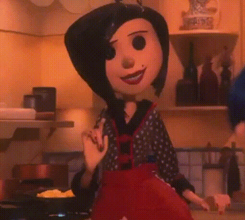 A Cartoon Character Is Standing In A Kitchen With A Frying Pan In Front Of Her . GIF