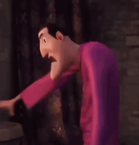 A Cartoon Character Is Standing In Front Of A Brick Wall And Making A Funny Face . GIF