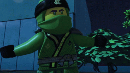A Cartoon Character Is Standing In Front Of A Building With A Green Light Coming Out Of His Head GIF