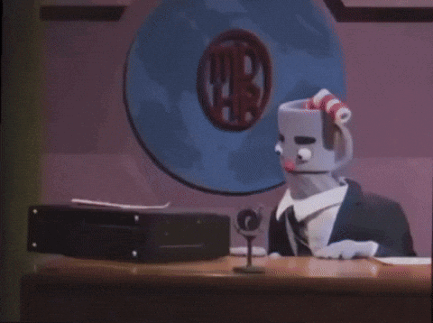 A Cartoon Character Is Standing In Front Of A Sign That Says ' Ti ' GIF