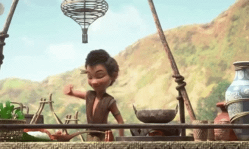 a cartoon character is standing in front of a stove with a hot air balloon hanging from it .