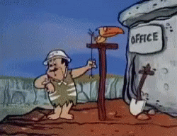 A Cartoon Character Is Standing In Front Of An Office GIF