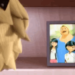 A Cartoon Character Is Standing Next To A Picture Of A Family On A Table . GIF