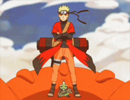 A Cartoon Character Is Standing On A Giant Orange Object GIF