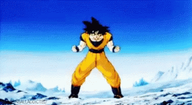 A Cartoon Character Is Standing On A Snow Covered Mountain . GIF