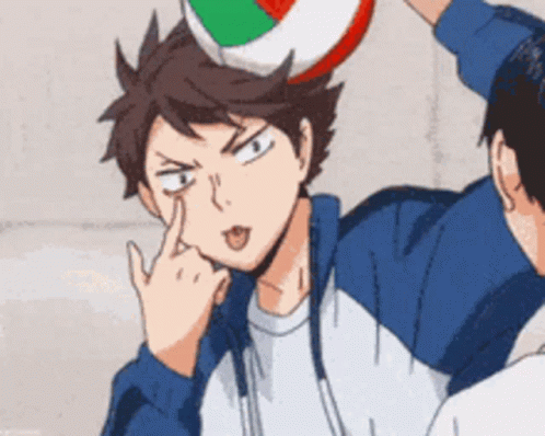 A Cartoon Character Is Sticking His Tongue Out While Holding A Volleyball On His Head . GIF