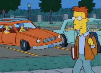 A Cartoon Character Is Walking Down The Street With A Book GIF