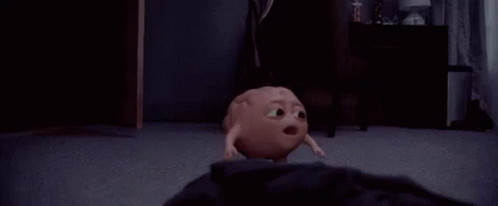A Cartoon Character Is Walking On A Carpeted Floor In A Room . GIF