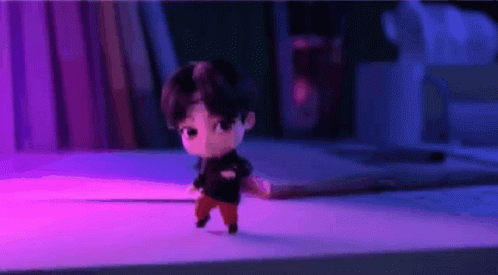A Cartoon Character Is Walking On A Table In A Room . GIF