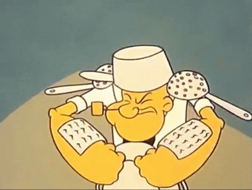 A Cartoon Character Is Wearing A Chef 'S Hat And Holding Spoons GIF