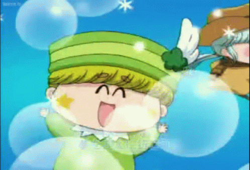 A Cartoon Character Is Wearing A Green Hat With Wings On It GIF