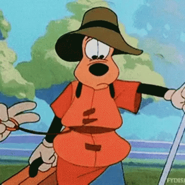 A Cartoon Character Is Wearing A Hat And Holding A Suitcase . GIF