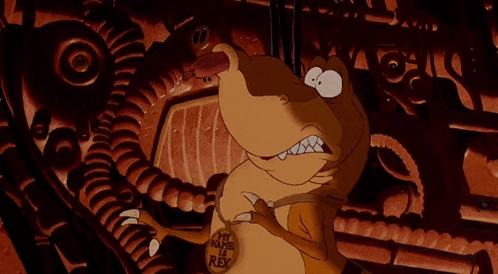 A Cartoon Character Is Wearing A Necklace With A Lion On It GIF