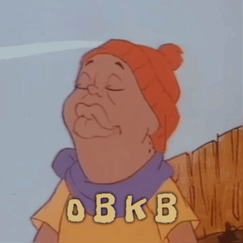 A Cartoon Character Is Wearing An Orange Hat And A Purple Scarf With The Letters O B K B On His Shirt GIF
