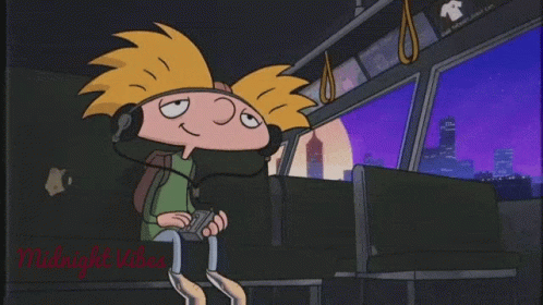 A Cartoon Character Is Wearing Headphones While Sitting On A Bus . GIF