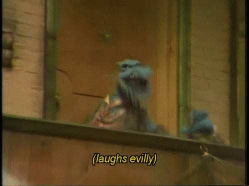 A Cartoon Character Laughs Evilly While Looking Out Of A Window GIF