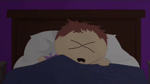 A Cartoon Character Laying In Bed With His Eyes Crossed GIF