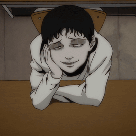 A Cartoon Character Laying On A Table With His Head On His Hand GIF
