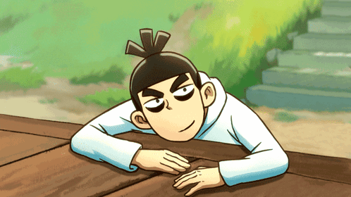 A Cartoon Character Laying On A Wooden Surface GIF