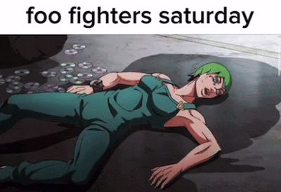A Cartoon Character Laying On The Ground With The Words " Foo Fighters Saturday " GIF