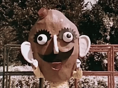 A Cartoon Character Made Out Of A Potato With A Big Smile On His Face GIF
