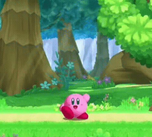 A Cartoon Character Named Kirby Is Standing On A Path In A Forest GIF