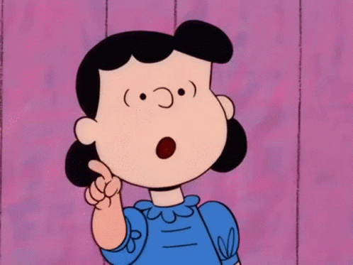 A Cartoon Character Named Lucy Is Pointing Her Finger Up GIF