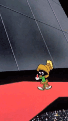 A Cartoon Character Named Marvin The Martian Is Standing On A Red Carpet GIF