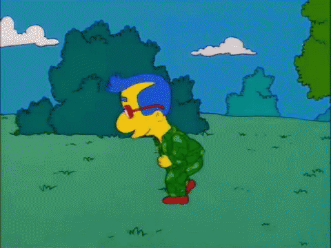 A Cartoon Character Named Milhouse Simpson Is Walking Through A Grassy Field GIF