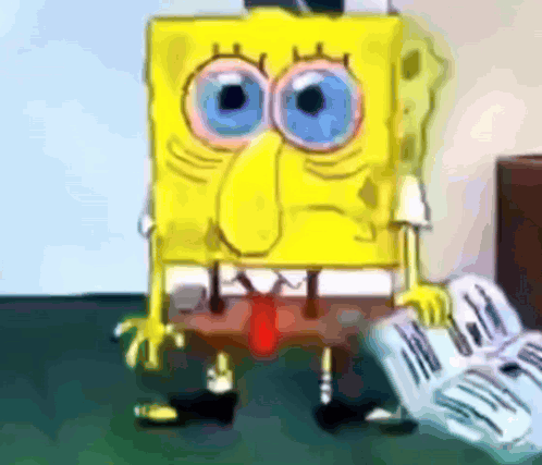 A Cartoon Character Named Spongebob Holding A Newspaper GIF