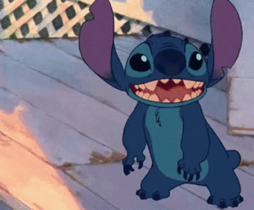 A Cartoon Character Named Stitch Is Smiling And Standing On A Wooden Floor GIF
