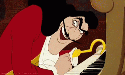 A Cartoon Character Playing A Piano With A Hook In His Mouth GIF
