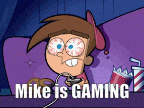 A Cartoon Character Playing A Video Game With The Words Mike Is Gaming Below Him GIF