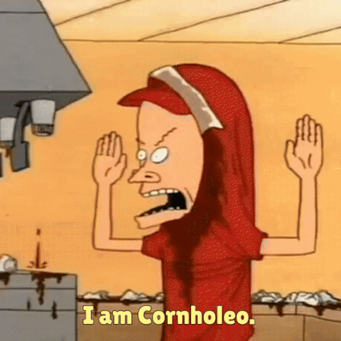A Cartoon Character Says " I Am Cornhole " While Wearing A Red Shirt GIF