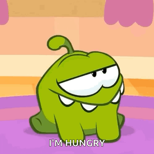 A Cartoon Character Says I 'M Hungry While Sitting On The Floor . GIF