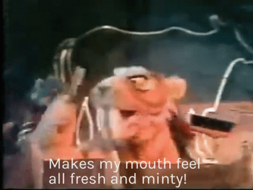 A Cartoon Character Says " Makes My Mouth Feel All Fresh And Minty " While Wearing Headphones GIF