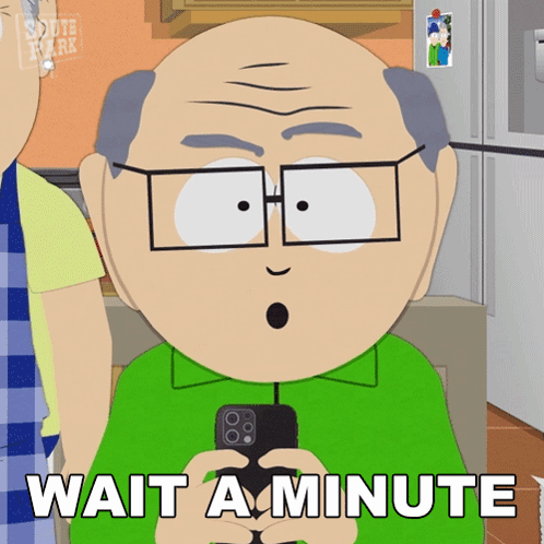 A Cartoon Character Says Wait A Minute While Holding A Phone GIF