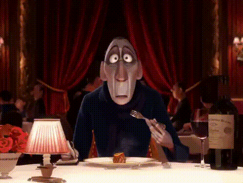 A Cartoon Character Sitting At A Table With A Bottle Of Wine GIF
